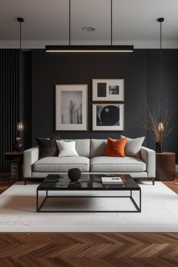 Matte Black Accent Wall with Soft Gray Sofa and Brass Frames