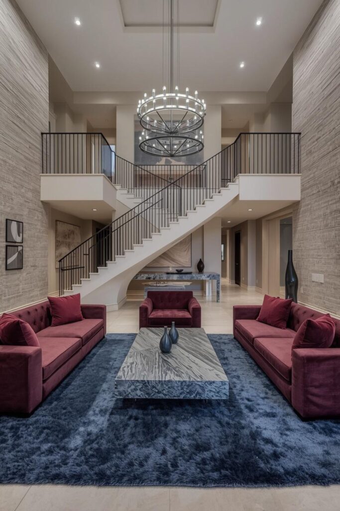 Burgundy and Limestone Double Height Living Room With Symmetry