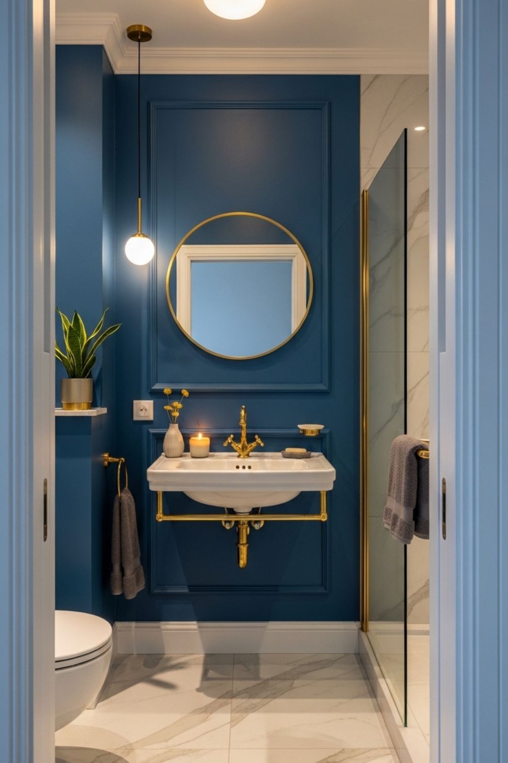 Small Blue and Gold Bathroom Interior with Navy Walls and Brass Fixtures